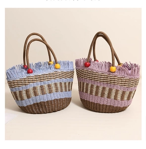 Straw bucket bags with colorful tassels and wood bead handles in blue and purple