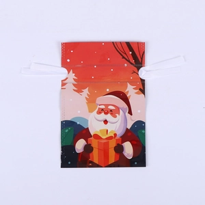 Detail view of red Christmas drawstring gift bag with Santa Claus snowy forest illustration