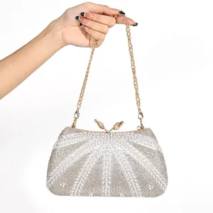 Handmade beaded evening bag with fan-shaped pearl patterns and vintage gold metal frame