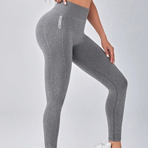 Dark grey high-waisted gym leggings with white GYMWEAR text and seamless lifting design