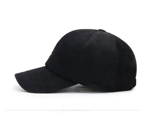 Close-up of black faux mink fur baseball cap with silver Sport metal badge detail