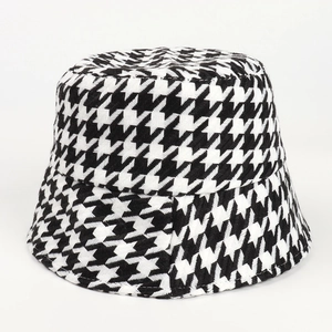 Close-up of black and white houndstooth pattern on high-quality knit bucket hat