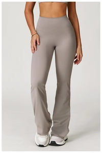 Detail of high-waisted taupe flare yoga pants showing smooth fabric and seamless waistband