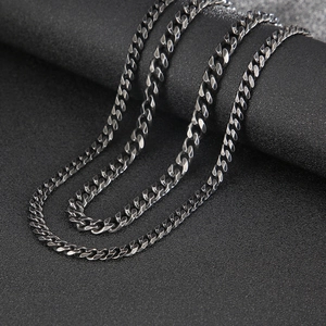 Close-up of vintage gunmetal stainless steel Cuban chain necklace with detailed links