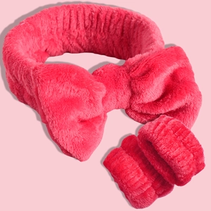 Plush hot pink spa set with soft microfiber bow headband and matching wrist washbands