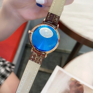 Detail of rose gold watch back with 14mm brown genuine leather strap and embossed logo