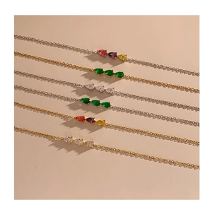 Minimalist stainless steel bracelet with teardrop zircons in gold and silver finish