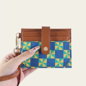 Handheld RFID blocking card holder with brown leather and geometric windmill pattern
