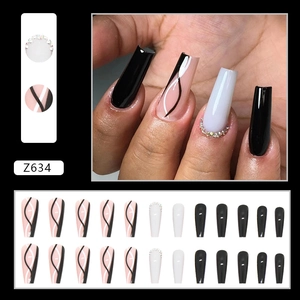 Chic black and white wavy pattern coffin false nails with sparkling rhinestone accents