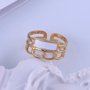 Gold plated stainless steel open ring with white enamel chain design on stone base