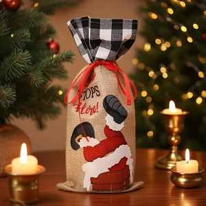 Linen Christmas wine bottle bag with red drawstring and Santa Claus Stops Here print