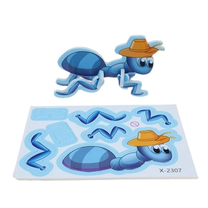 Close-up of 3D ant cartoon puzzle with assembled model and flat assembly board sheet