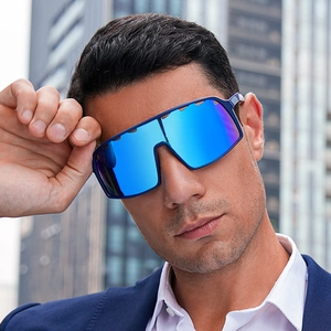 Close-up of blue mirrored sports cycling sunglasses on a model with a city background