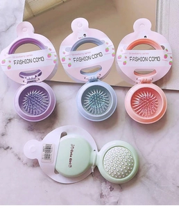 Portable folding hairbrush with mirror in pastel purple, blue, pink and green colors