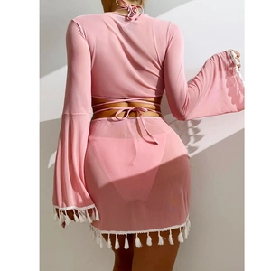 Detailed back view of pink mesh beach set featuring long sleeves and white cotton fringe