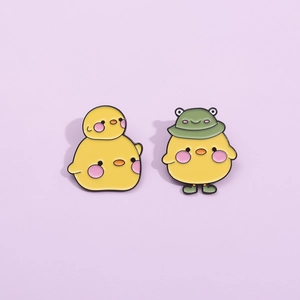 Cute cartoon yellow duck enamel pins set with frog hat design and vibrant yellow finish