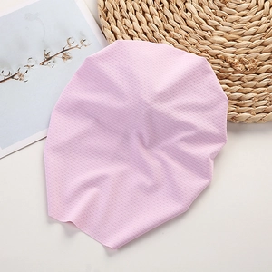 Close-up of pink mesh fabric detail for breathable baby headband showing soft texture
