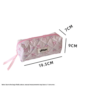 Detail view of pink quilted floral pencil case with ribbon zipper and size dimensions