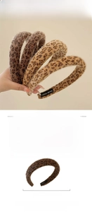 Macro detail of plush leopard print headband showing soft texture and hand-made label