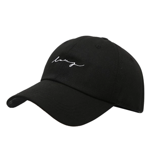 Classic black cotton baseball cap with white cursive embroidery and curved brim