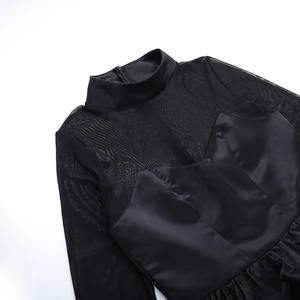 Detail of high collar mesh patchwork and glossy satin fabric on black slim dress