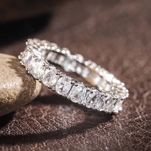 Macro detail of silver eternity ring featuring oval-cut zircons in a four-prong setting