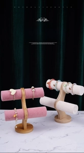 Detail of dual-tier bamboo and velvet T-bar jewelry stand for bracelets and watches