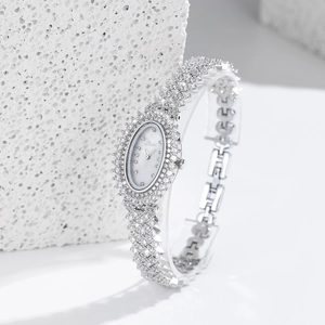 Elegant silver oval women's watch featuring a white dial and sparkling zircon-set bracelet