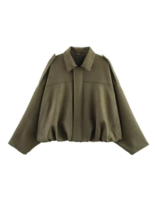 Detail of olive green suede bomber jacket showing epaulettes and matte fabric texture