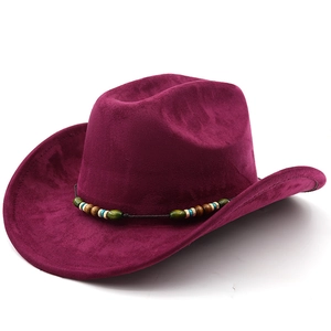 Close-up of wine red suede cowboy hat with ethnic beaded band on a white background
