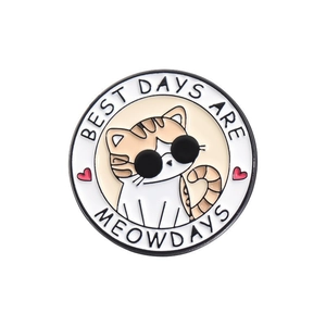 Cartoon cat metal brooch with BEST DAYS ARE MEOWDAYS text on a white circular badge
