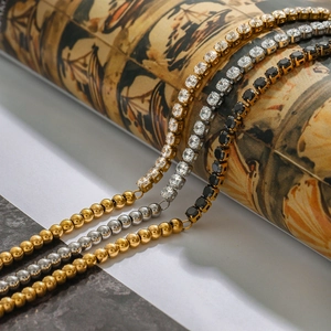 Macro shot of three stacked tennis bracelets with cubic zirconia in gold and silver finish