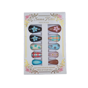 Set of 24 almond press-on nails featuring 3D flowers, plaid patterns, and nude gradients