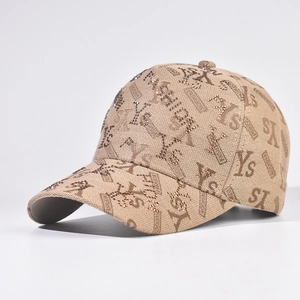 Detail of embroidered khaki baseball cap with shiny rhinestones and YS letter pattern