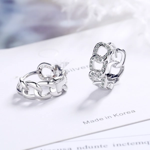 Minimalist silver chain hoop earrings with sparkling cubic zirconia on display card