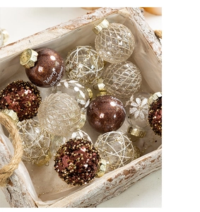 Detail of luxury brown and white Christmas ornaments with glitter in a vintage wooden box