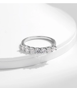Close-up of a s925 silver eternity ring with seven round-cut moissanite stones