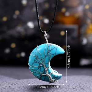 Detailed view of turquoise moon pendant with wire tree wrap showing 4.5cm x 3.0cm size
