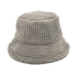 Detailed texture of gray sherpa bucket hat with soft plush fleece for winter warmth