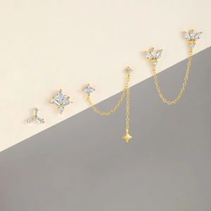 Detailed set of gold plated S925 silver earrings with tassels and sparkling cubic zirconia