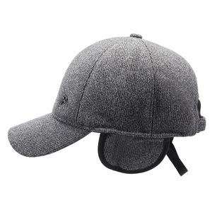 Grey textured winter baseball cap for men with adjustable ear flaps and metal logo detail