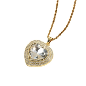 Luxurious gold heart pendant necklace with large zircon stone on a rope chain