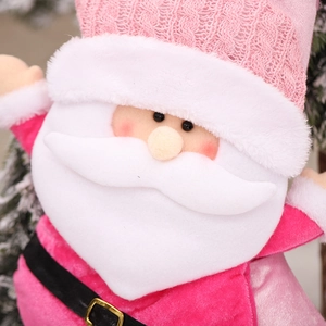 Plush pink Santa Claus ornament with knitted hat decoration and white beard detail