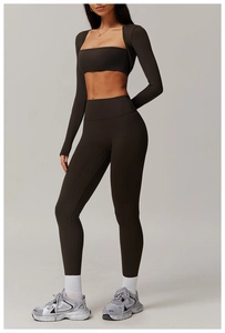 Detailed view of espresso-colored three-piece yoga set with cropped zip hoodie and leggings