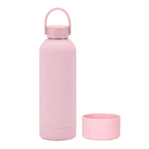 Detail view of pink insulated stainless steel bottle with silicone base and carry handle