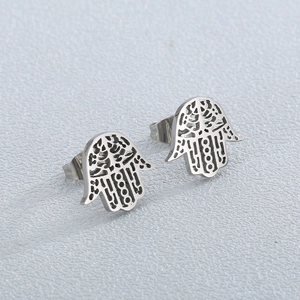 Titanium steel Hamsa hand stud earrings featuring intricate hollow patterns in silver finish