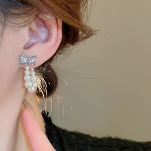 Elegant bow knot earrings with sparkling cubic zirconia and double-row imitation pearls