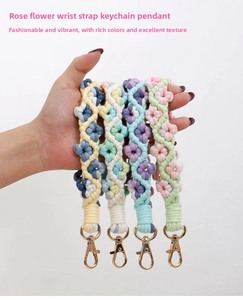 Detail view of four handmade bohemian floral wristlet keychains with gold swivel clasps