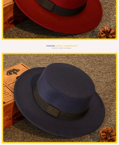 Detailed view of children's wool felt hats in wine red and navy with grosgrain ribbon