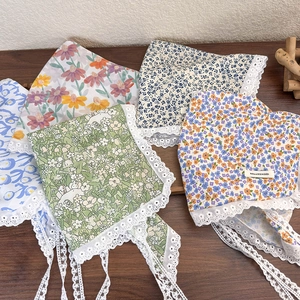 Set of five floral lace headscarves in vintage French style on a rustic wooden background